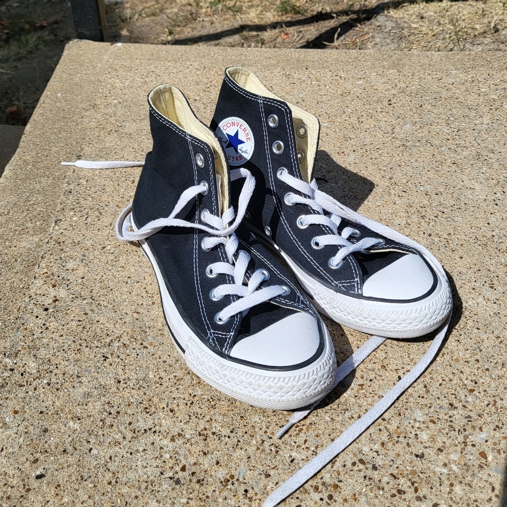 Black high-top Chuck Taylor converse
